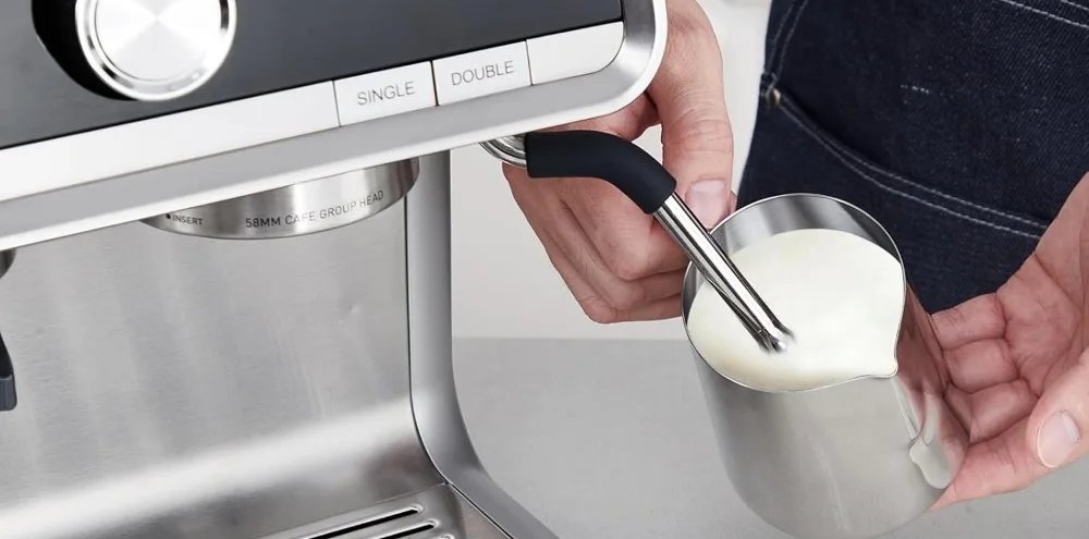 Steam wand frothing milk